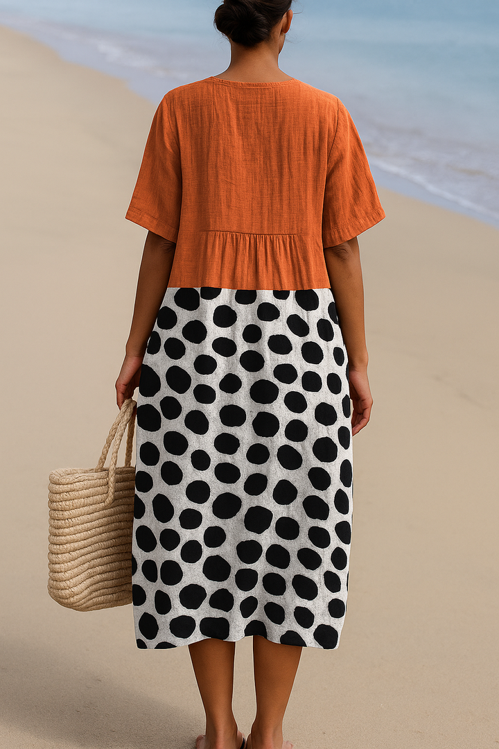 Maelle | Orange dress with contrasting polka dots